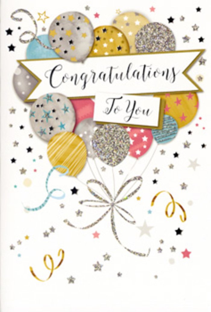 This photograph shows a refined congratulations card whose design suggests a gentle, sparkling celebration unfolding over Shadwell. The front of the card is dominated by a cluster of illustrated balloons, arranged in a loose, almost bouquet-like formation that rises from the lower portion of the card and fills the central space. The balloons come in harmonious shades of metallic gold, cool silver, soft champagne, clear sky blue, gentle blush pink, and calm grey. Each balloon features delicate decorative details-tiny glittering stars, subtle stripes, or speckled metallic highlights-catching the light like reflections along the water by Shadwell Basin. Slender ribbons trail from the base of each balloon, drawn in fluid lines of gold and silver ink that curl and loop as though gently swaying in a light breeze, much like festive streamers at a gathering on a quiet Shadwell side street. A graceful banner arcs across the middle of the cluster, supporting the words Congratulations To You written in flowing, stylish calligraphy, lending the design a timeless, slightly formal character. The pale background, perhaps a soft ivory or off-white, is scattered with tiny stars, shimmering dots, and delicate ribbon swirls, creating a confetti-like effect that remains airy and uncluttered. The overall finish appears semi-glossy, with certain glittered portions slightly raised, inviting the fingers to explore the texture. The emotional tone is joyful yet composed, ideal for marking important life moments-from promotions along The Highway to exam successes or personal milestones. As a florist accustomed to pairing such cards with bouquets for local deliveries around Shadwell, the design feels perfectly balanced between festive and refined, ready to accompany fresh flowers in celebrating someone's well-deserved success.