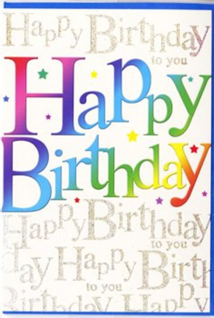 The birthday card shown in this image radiates a bright, festive charm that feels perfectly at home in Shadwell's vibrant, close-knit community. Propped upright against a simple, light background, its front is dominated by the words Happy Birthday written in a generous, flowing typeface that curves with a gentle sense of movement. The letters are richly coloured, each one carrying its own portion of a flowing rainbow that sweeps across the phrase. Starting at one end with intense cherry and wine-red tones, the colours drift effortlessly into coral and fiery orange, then mellow into luminous yellow, fresh spring green, aqua, and cool blue, before settling finally into deep indigo and purple. The gradient is sophisticated yet playful, evoking the look of ink carefully blended by hand, with a subtle sheen that suggests a smooth, almost satin-finished card stock. Behind this vivid greeting, a delicate background of repeated text fills the entire card, where the phrase Happy Birthday to you is written again and again in slender, cursive script. This background wording is executed in soft, metallic gold that glimmers lightly, reminiscent of evening light touching the brick facades and windows near Shadwell DLR. The lines of script form a gentle wave-like pattern, giving depth and a sense of musical rhythm to the design-as if a quiet choir of voices were softly singing in the background. Tiny flecks of brighter gold and occasional specks of colour sparkle discreetly between the lines, adding a celebratory twinkle like confetti scattered beside a birthday cake and a vase of fresh flowers. The overall impression is one of thoughtful celebration: bold, joyful colour married with fine golden detail, making this card an elegant companion to a floral birthday surprise delivered anywhere across Shadwell and the surrounding neighbourhoods.
